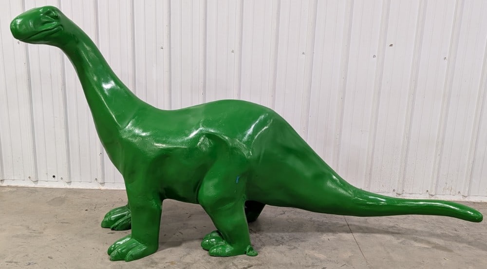 7ft Sinclair Dino The Dinosaur Cast Metal Statue: Giant Sinclair Dino custom cast metal statue. Appears to be in good condition with some paint loss, scratches, and wear from display and storage. Measures approximately 7ft across by 4ft tall.