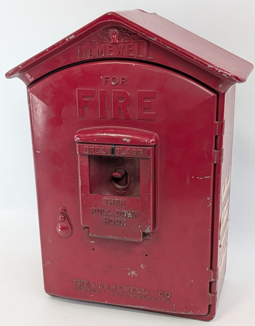 Vintage Gamewell Cast Metal Fire Alarm Call Box: Vintage Gamewell cast metal fire alarm call box. Has paint loss, missing glass, missing internal components, and other wear from use and age. It measures approximately 16-3/4in across by 12-1/2in