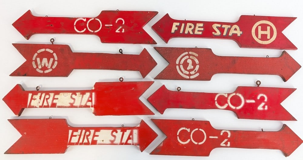 8) Vintage 2-Sided Wood Fire Station Arrow Signs: Lot of eight vintage double sided wood fire station hand painted arrow signs. They have paint loss, discoloration, and other wear from use and age. Some of the arrows you can see there are multiple la