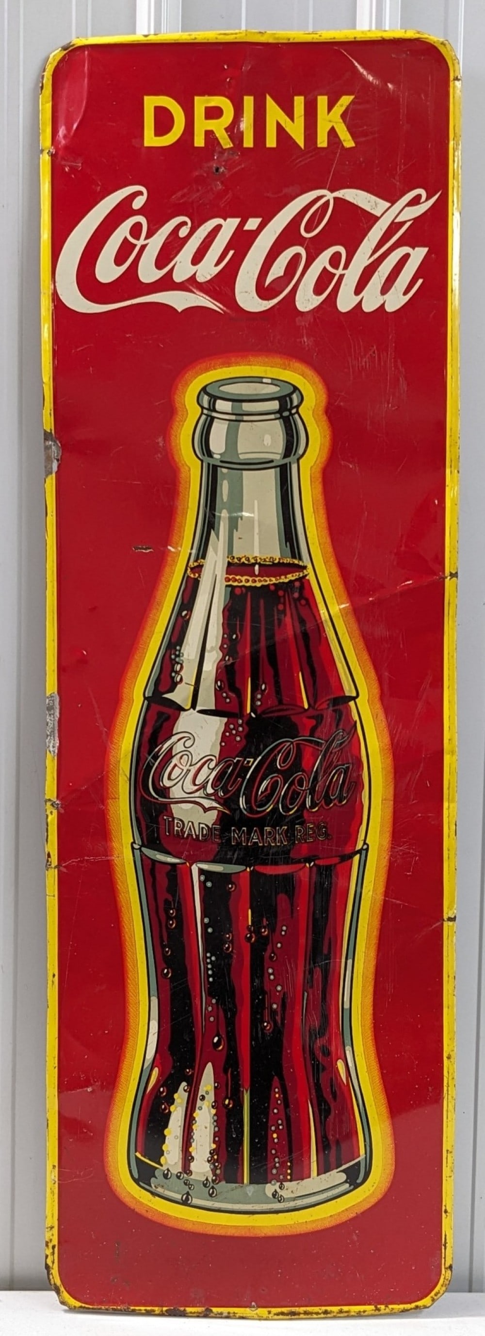 53in Vintage SST Coca-Cola Soda Bottle Advertising Sign: Vibrant original vintage single sided tin Coca-Cola bottle advertising sign. Has paint loss, scratches, bends, and other wear from use and age. Displays well with vibrant colors and bottle graphic. It