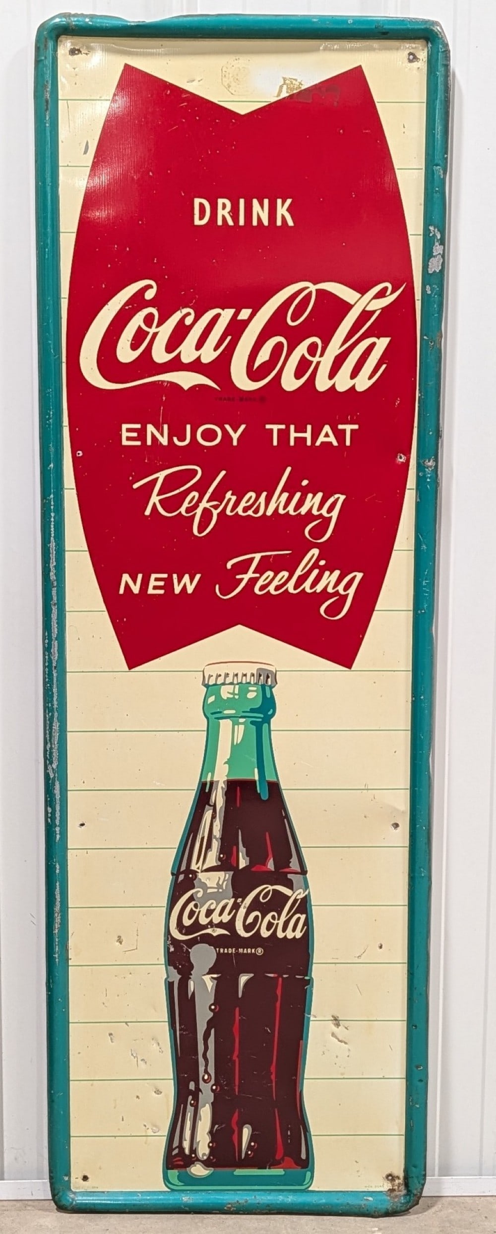 Large Vintage SST Coca-Cola Fish Tail Advertising Vertical Sign: Large vintage single sided tin self embossed frame Coca-Cola Fishtail advertising sign. Has paint loss, scratches, some dents on the edges, and other wear from use and age. Displays very well with