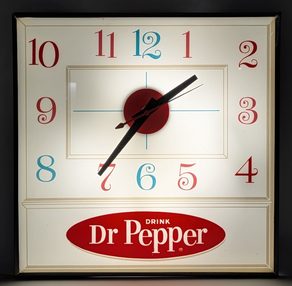 Vintage Dr. Pepper Lighted Advertising PAM Clock: Vintage Dr. Pepper lighted advertising PAM clock. The clock is in good condition overall with some scratches and light wear to the metal can. Measures approximately 15-1/4" across by 15-1/4" tall.?