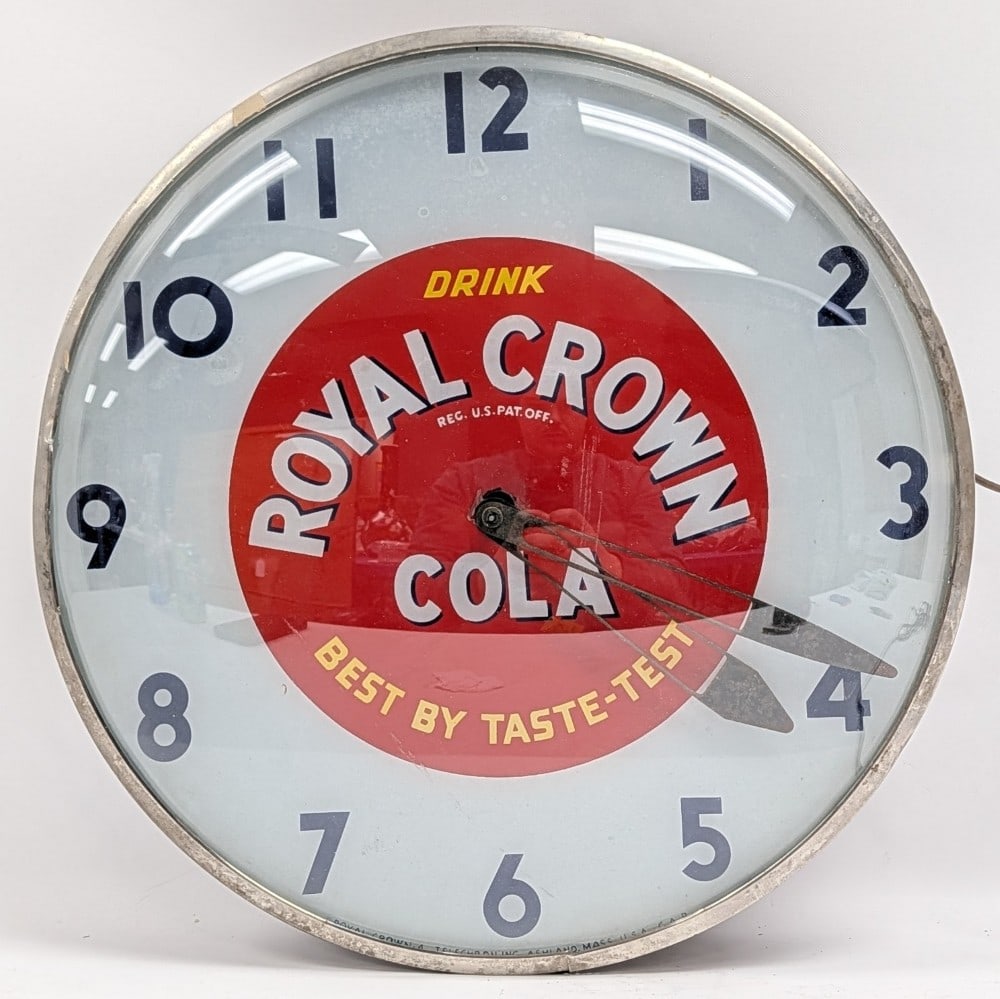 Vintage Telechron Royal Crown Cola Lighted Clock: Vintage Telechron Royal Crown Cola Lighted advertising clock. Clock is in fair condition with some damage to composite body, paint loss surface rust, chips on the inner face ring for the clock hands,