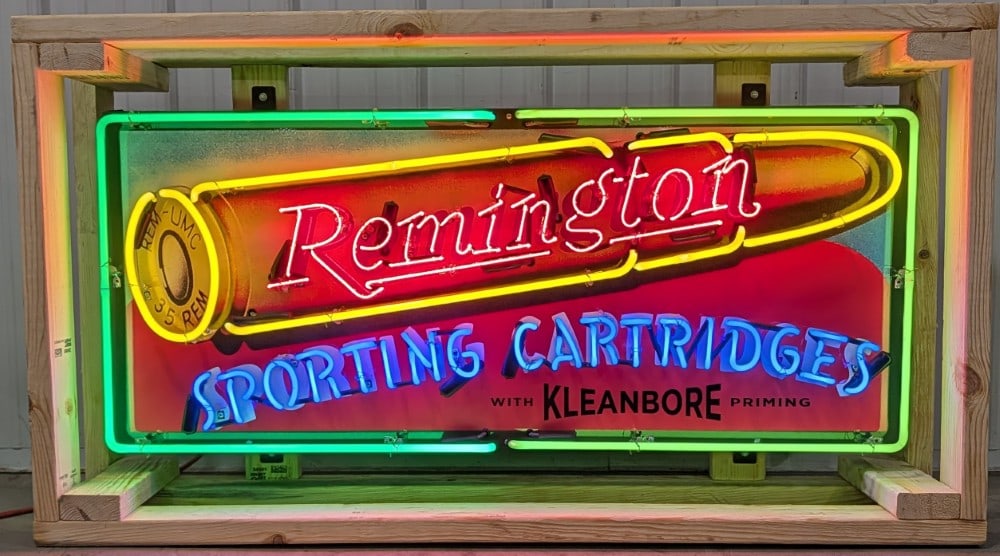 4ft Custom Remington Tin Animated Neon Sign: Custom Remington 4-Color animated Neon Sign. It features High gloss shine with UV protection- NEW neon glass, transformers, on a die cut metal can with hanging brackets- Crated for transportation. The