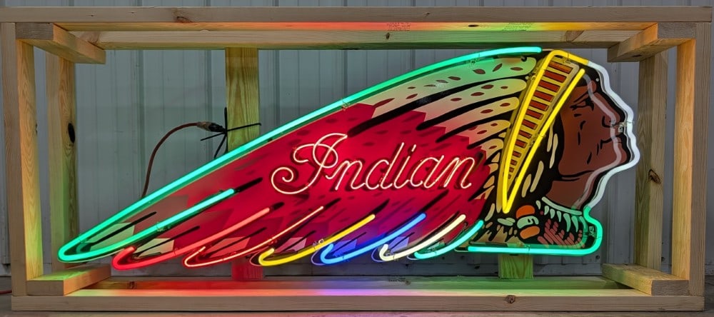 Custom Indian Motorcycle Neon Sign: Single sided tin custom Indian Motorcycles neon advertising sign. Sign features high gloss shine, new neon glass,and transformers. Easily displayed with die cut can featuring hanging brackets. Has bee