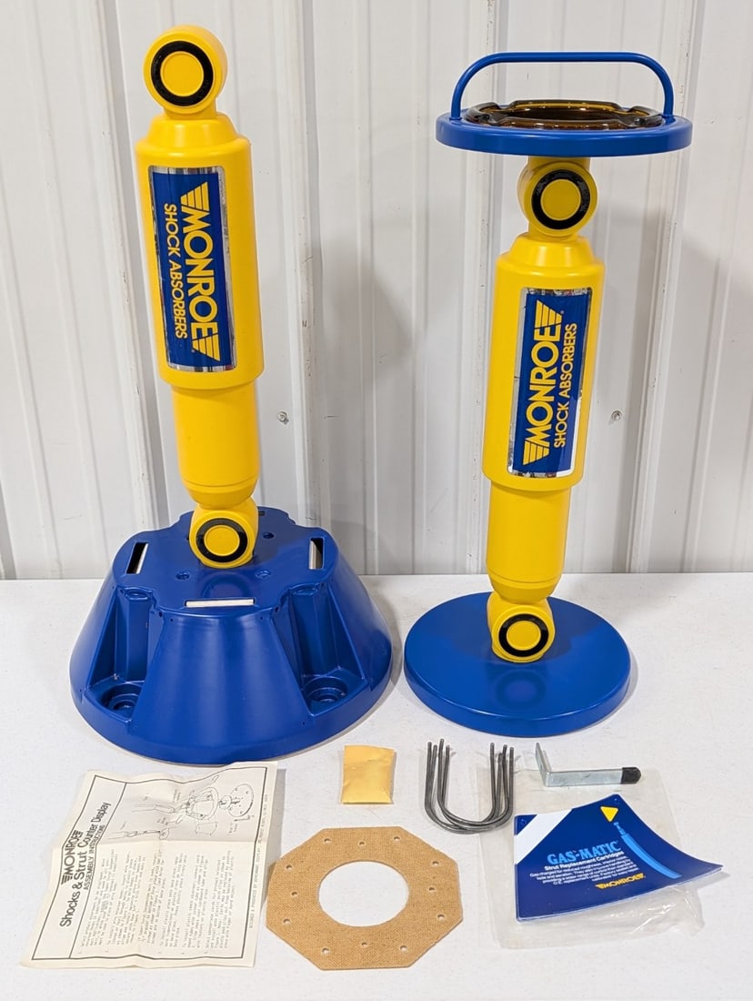 Vintage NOS Monroe Shock Absorbers Store Display & Ashtray: Vintage new old stock Monroe Shock Absorbers store display and promotional ashtray. Both appear to be in nice condition with wear from age and storage. The store display has not been fully assembled o