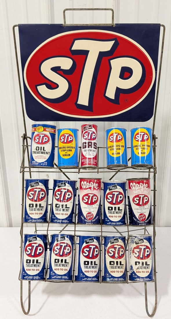 Vintage STP Oil Treatment Additive Display Rack Full Of Cans: Vintage STP Oil Treatment additive store display rack full of vintage cans. Lot includes STP rack with single sided embossed tin topper sign and (15) full cans. Cans include both metal and composite.