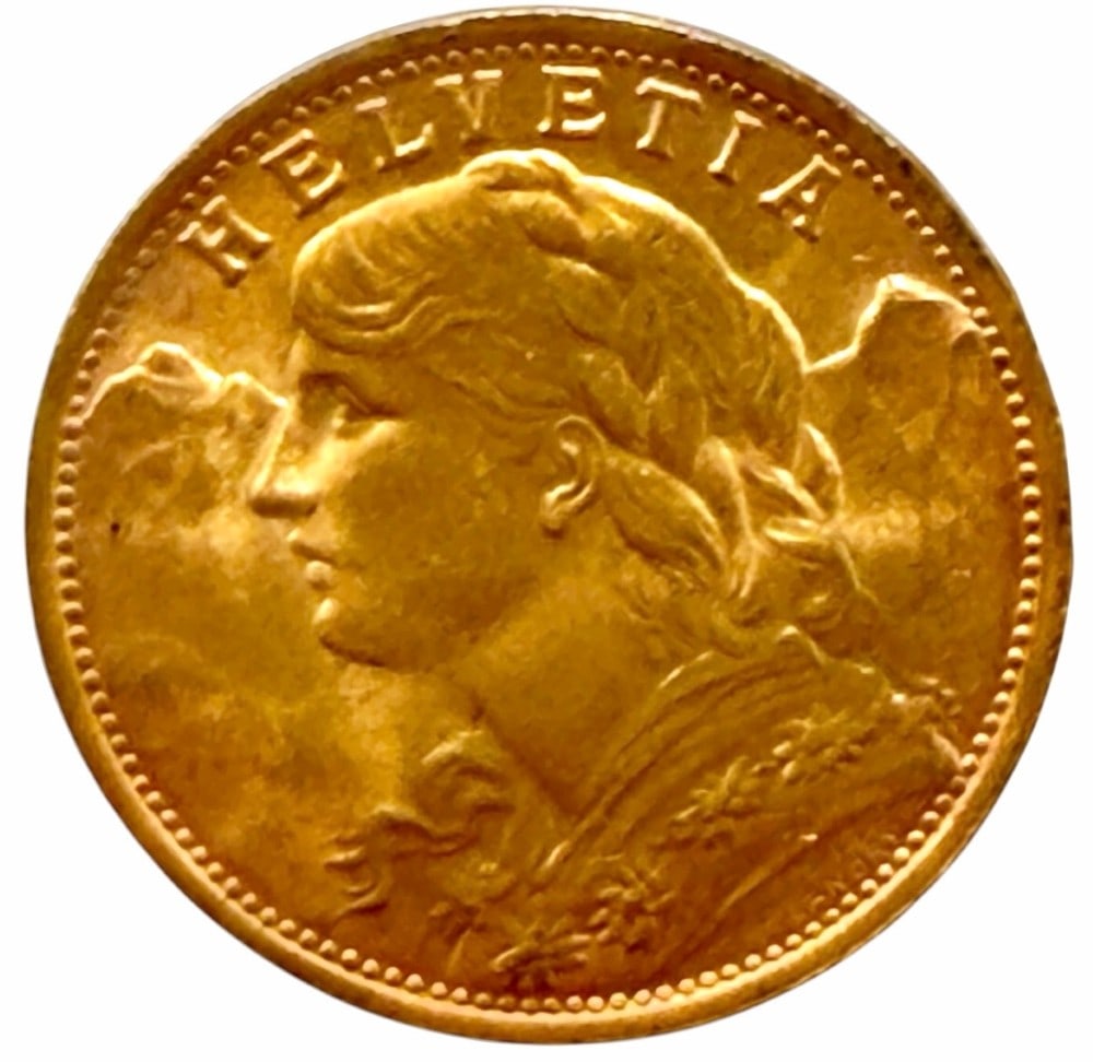 1935-B Swiss 20 Franc 90% Fine Gold Coin: 1935-B Swiss 20 Franc Gold Coin. The coin is 90% fine gold and the actual gold weight is 0.1867 troy ounce of pure gold.