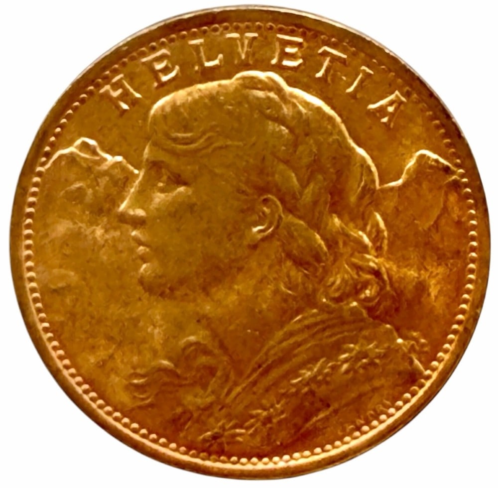 1935-B Swiss 20 Franc 90% Fine Gold Coin: 1935-B Swiss 20 Franc Gold Coin. The coin is 90% fine gold and the actual gold weight is 0.1867 troy ounce of pure gold.
