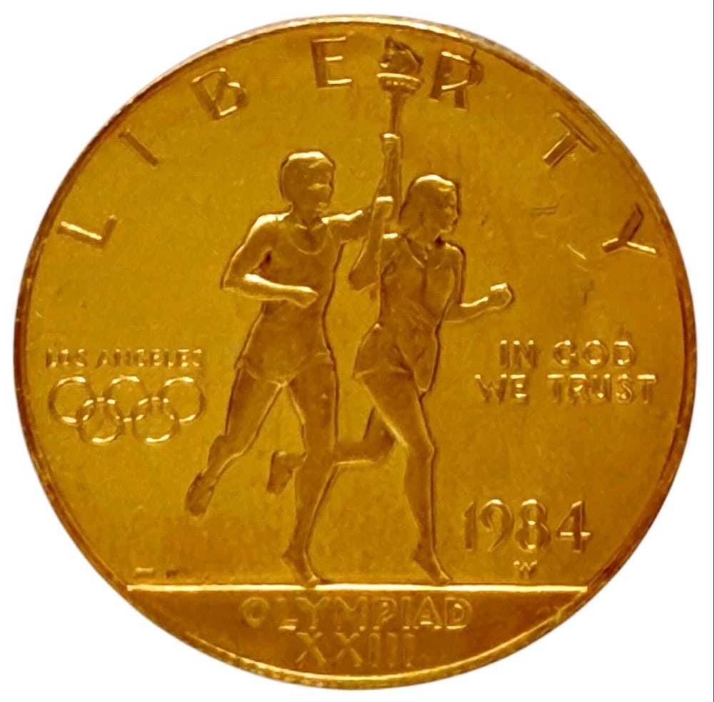 1984-W United States $10 Olympiad XXIII Commemorative Gold Proof Coin: 1984-W United States $10 Olympiad XXIII Commemorative Gold Proof Coin. The coin contains .4847 troy ounce of .999 pure gold. Comes in capsule.