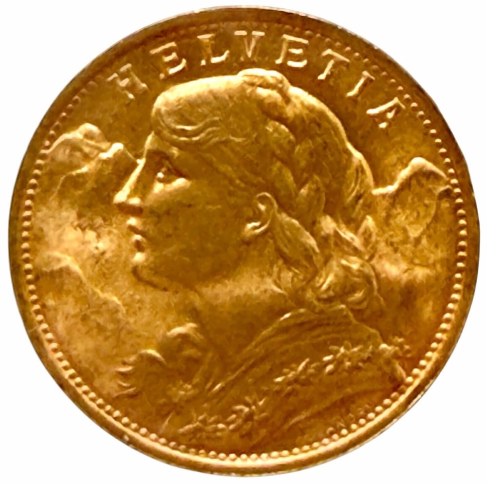 1935-B Swiss 20 Franc 90% Fine Gold Coin: 1935-B Swiss 20 Franc Gold Coin. The coin is 90% fine gold and the actual gold weight is 0.1867 troy ounce of pure gold.
