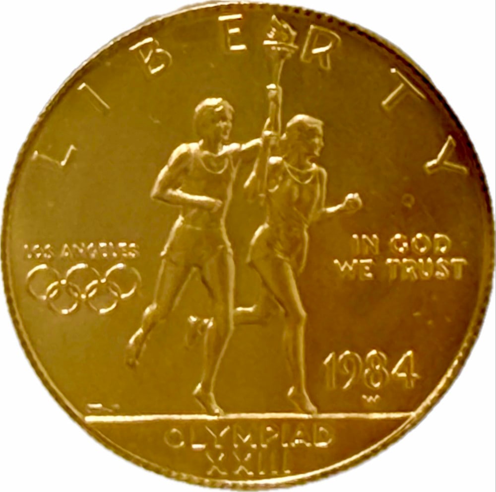 1984-S United States $10 Olympiad XXIII Commemorative Gold Proof Coin: 1984-S United States $10 Olympiad XXIII Commemorative Gold Proof Coin. The coin contains .4847 troy ounce of .999 pure gold. Comes in capsule.