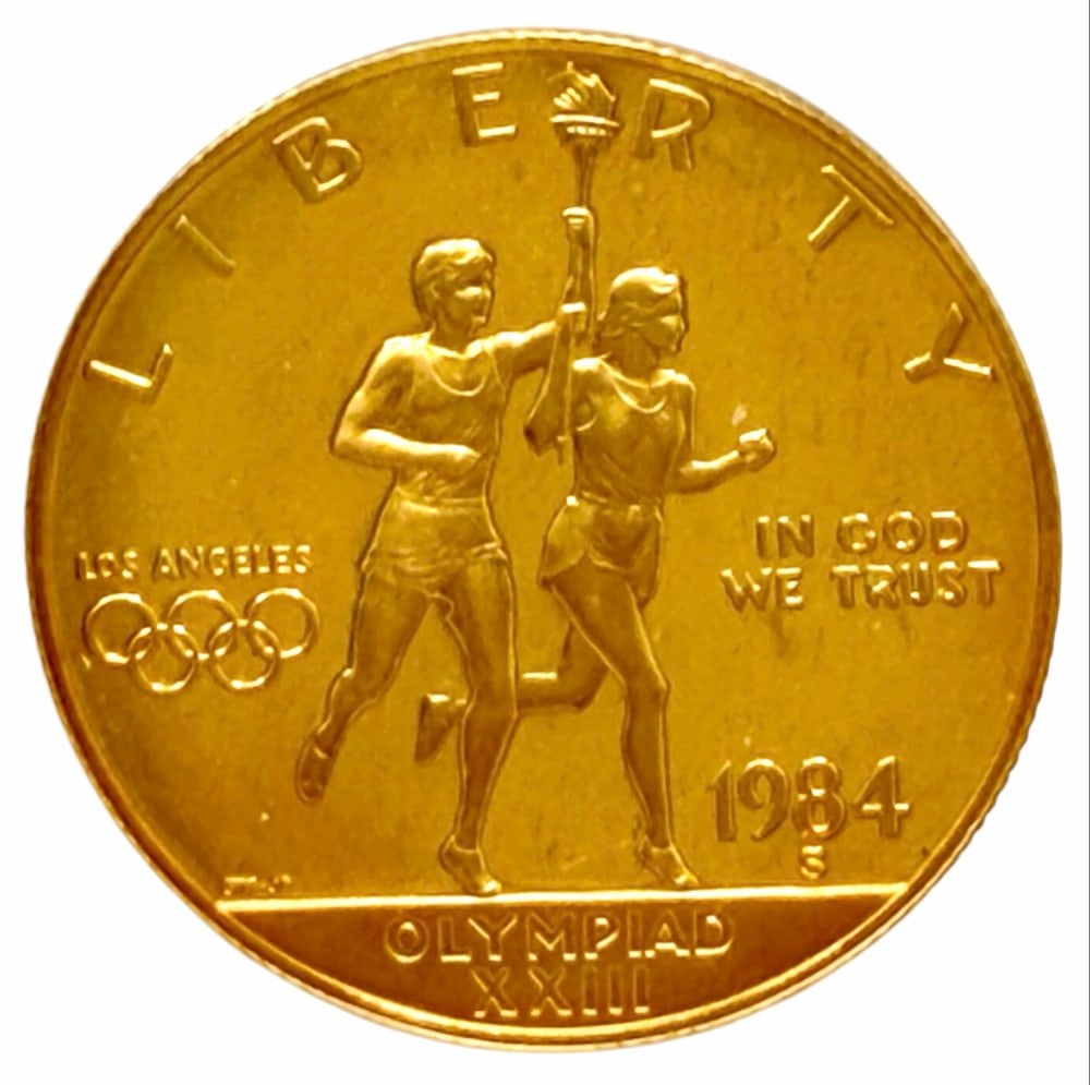 1984-S United States $10 Olympiad XXIII Commemorative Gold Proof Coin: 1984-S United States $10 Olympiad XXIII Commemorative Gold Proof Coin. The coin contains .4847 troy ounce of .999 pure gold. Comes in capsule.