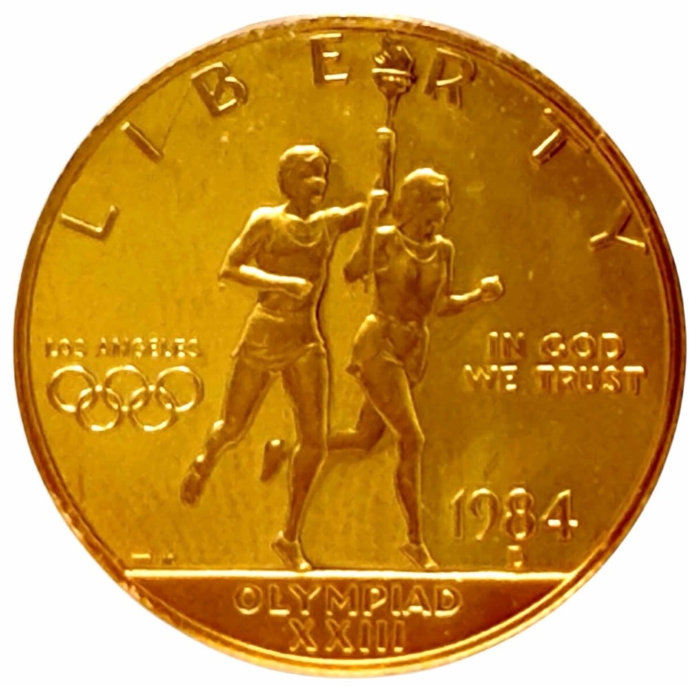 1984-D United States $10 Olympiad XXIII Commemorative Gold Proof Coin: 1984-D United States $10 Olympiad XXIII Commemorative Gold Proof Coin. The coin contains .4847 troy ounce of .999 pure gold. Comes in capsule.