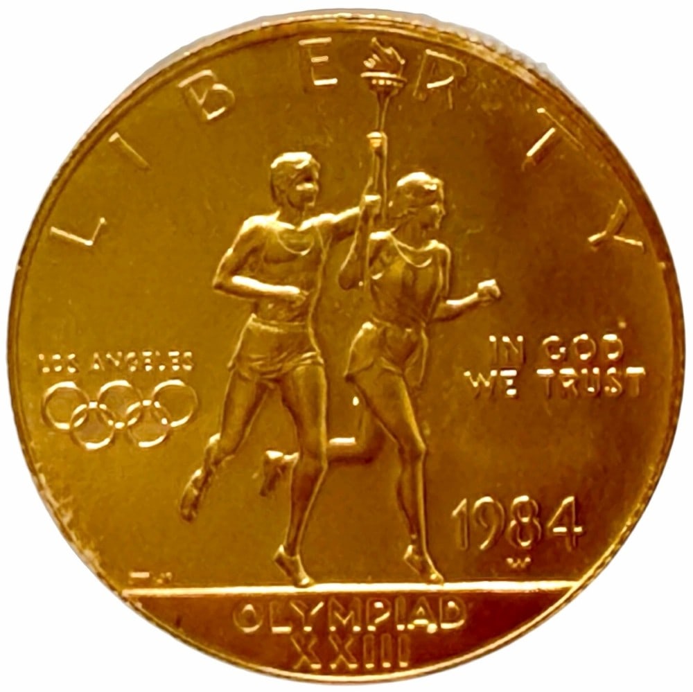 1984-W United States $10 Olympiad XXIII Commemorative Gold Uncirculated Coin: 1984-W United States $10 Olympiad XXIII Commemorative Gold Uncirculated Coin. The coin contains .4847 troy ounce of .999 pure gold. Comes in capsule.