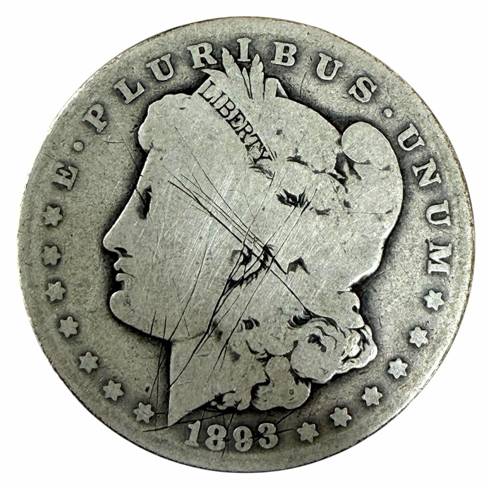 Key Date 1893-O United States Morgan Silver Dollar: Key Date 1893-O United States Morgan Silver Dollar in circulated condition, has some scratches on the obverse and reverse.