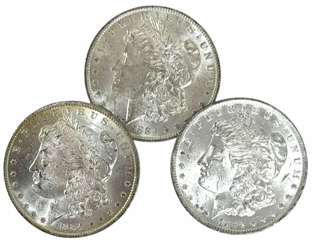 (3) 1884-O United States Morgan Silver Dollars: Lot includes (3) 1884-O Morgan Silver Dollars in AU-BU condition.