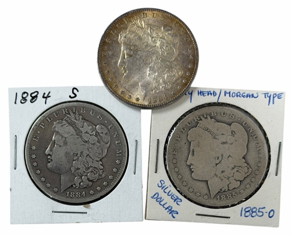 1884-O, 1884-S & 1885-O United States Morgan Silver Dollars: Lot includes (1) 1884-O, (1) 1884-S, and (1) 1885-O Morgan Silver Dollars in circulated condition.