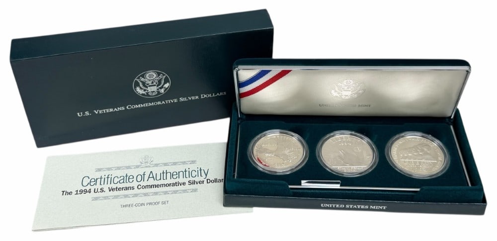 U.S. Mint 1994 U.S. Veterans Commemorative Proof Silver Dollar 3-Coin Set: U.S. Mint 1994 U.S. Veterans Commemorative Proof Silver Dollar 3-Coin Set. The coins are in new condition in the original box with paperwork. Each dollar is 90% silver and contains .7734 troy ounce of