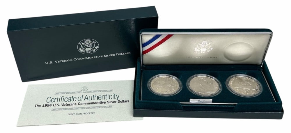 U.S. Mint 1994 U.S. Veterans Commemorative Proof Silver Dollar 3-Coin Set: U.S. Mint 1994 U.S. Veterans Commemorative Proof Silver Dollar 3-Coin Set. The coins are in new condition in the original box with paperwork. Each dollar is 90% silver and contains .7734 troy ounce of