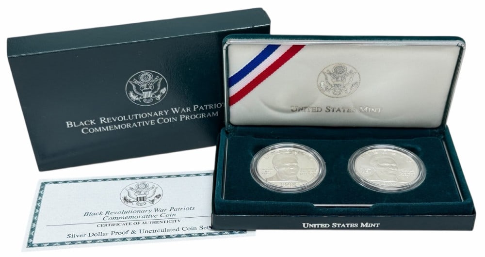 U.S. Mint 1998 Black Revolutionary War Patriots Commemorative Proof & Uncirculated Silver Dollar Set: U.S. Mint 1998 Black Revolutionary War Patriots Commemorative Proof & Uncirculated Silver Dollar 2-Coin Set. The coins are in new condition in the original box with paperwork. Each dollar is 90% silve