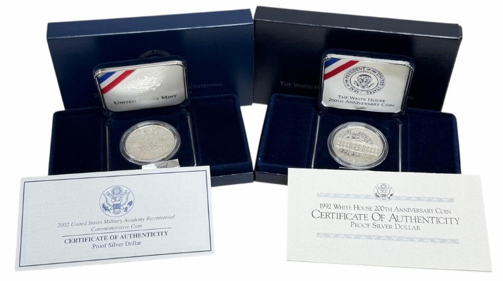 U.S. Mint 1992 White House & 2002 U.S. Military Academy Commemorative Proof Silver Dollars: U.S. Mint 1992 White House 200th Anniversary & 2002 U.S. Military Academy Bicentennial Commemorative Proof Silver Dollars. The coins are in new condition in the original box with paperwork. Each dolla