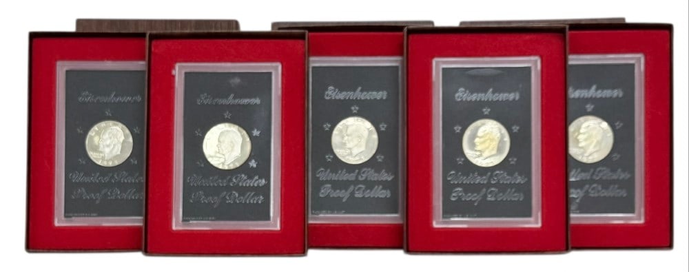 (5) 1973-S United States Proof Brown Eisenhower Silver Dollars: (5) 1973-S United States Proof Brown Eisenhower Silver Dollars. The dollars are 40% silver and come in the original mint packaging.