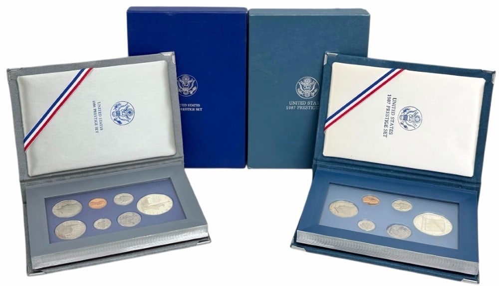1986 & 1987 United States Mint Prestige Proof Sets: 1986 & 1987 U.S. Mint Prestige Proof Sets. The sets are in new condition in the original boxes with paperwork. The 1986 set includes the 90% silver Statue of Liberty Commemorative Dollar and the 1987