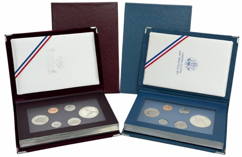 1987 & 1988 United States Mint Prestige Proof Sets: 1987 & 1988 U.S. Mint Prestige Proof Sets. The sets are in new condition in the original boxes with paperwork. The 1987 set includes the 90% silver U.S. Constitution 200th Anniversary Commemorative Do