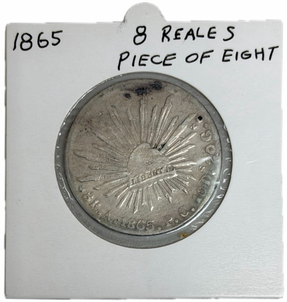 Key Date 1865-A PG Mexico First Republic 8 Reales Silver Coin: Key Date 1865-A PG Mexico First Republic 8 Reales Silver Coin. The coin is in circulated condition with average wear. Alamos Mint. The coin is .9030 fine silver, actual silver weight is .7859 troy oun