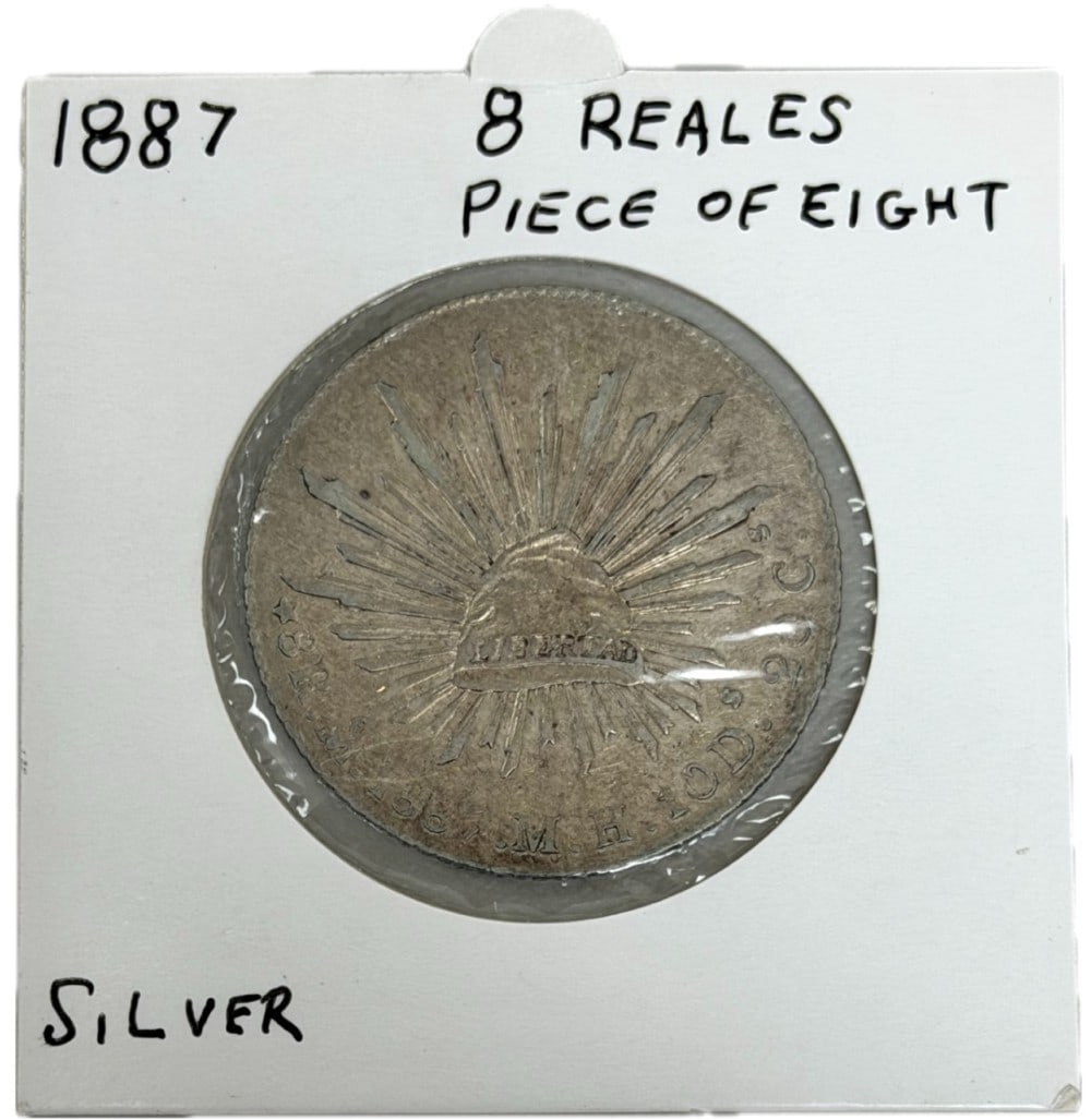 1887-Mo MH Mexico First Republic 8 Reales Silver Coin: 1887-Mo MH Mexico First Republic 8 Reales Silver Coin. The coin is in circulated condition with average wear. Mexico City Mint. The coin is .9030 fine silver, actual silver weight is .7859 troy ounces