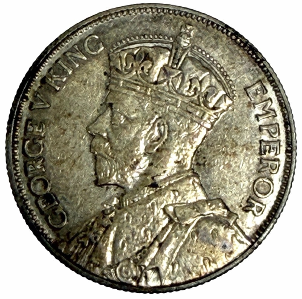 1935 New Zealand One Florin Silver Coin: 1935 New Zealand One Florin Silver Coin. The coin is 50% silver. Better condition toned coin.