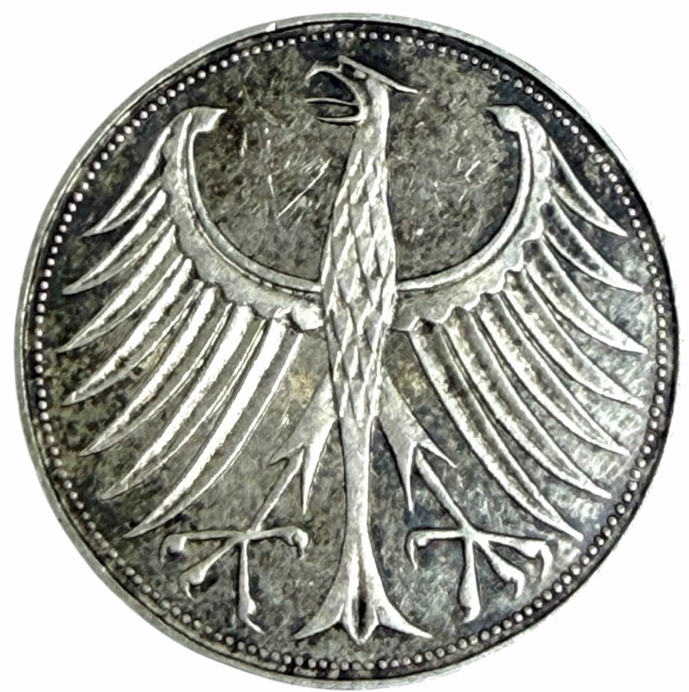 Better Date 1956-D Germany Federal Republic 5 Mark Silver Coin: Better Date 1956-D Germany Federal Republic 5 Mark Coin. The coin is 62.5% silver. Better date high grade circulated condition coin.