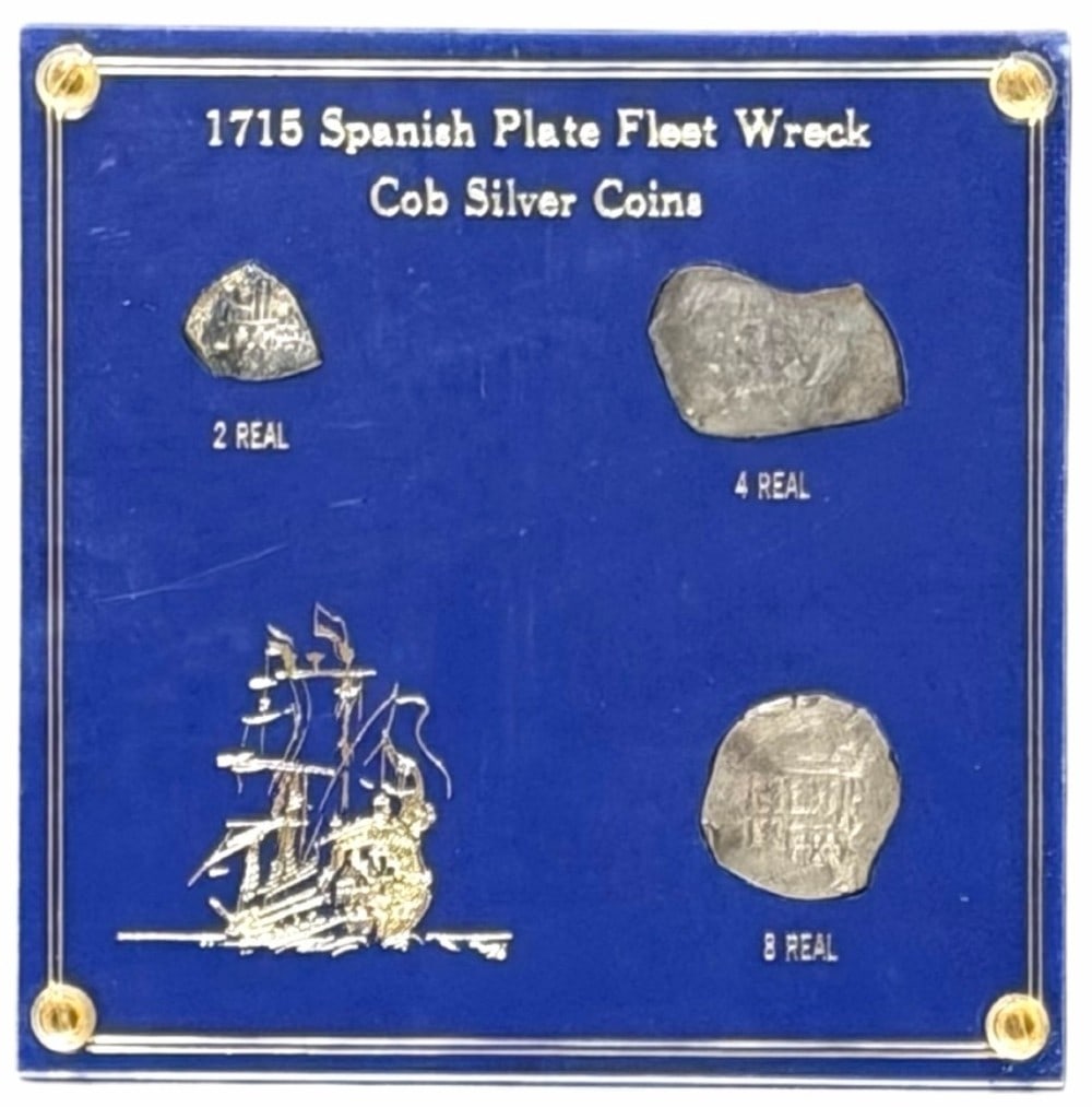 1715 Spanish Plate Fleet Wreck Cob Silver Coins: 1715 Spanish Plate Fleet Wreck Cob Silver Coins. The coins include a 2 Real, 4 Real, and 8 Real. Coins come in a plastic display holder.