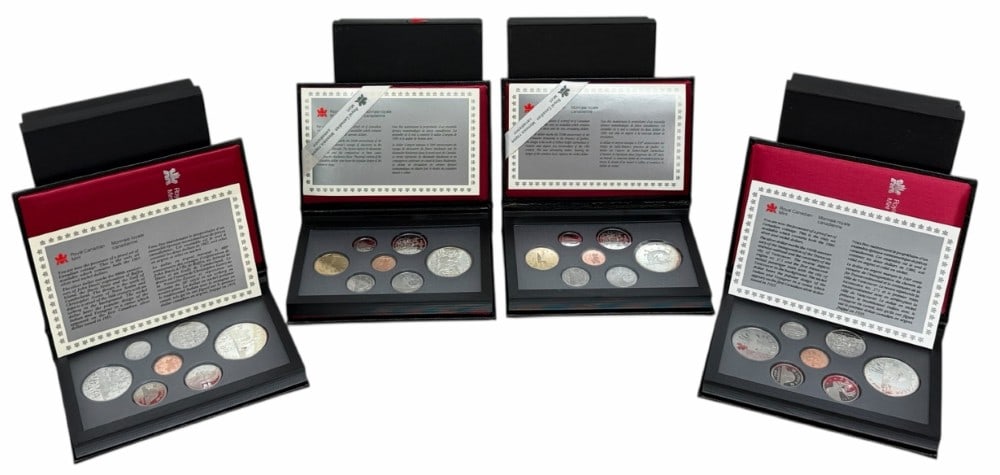 1986-1987-1988-1989 Canada Proof Sets With Silver Commemorative Dollars: 1986-1987-1988 & 1989 Canada Proof Sets. The sets are in new condition in the original boxes with paperwork. The 1986 set includes the 50% silver Locomotive Commemorative Dollar, the 1987 includes the