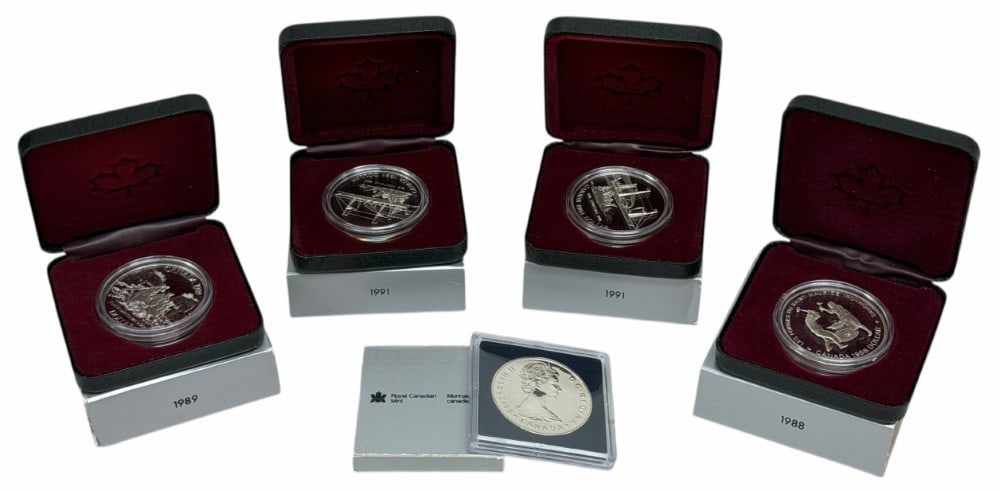 (5) Mixed Years Canada .500 Fine Silver Commemorative Dollars: (5) Mixed Years Canada .500 Fine Silver Commemorative Dollars. The coins are in new condition in the original boxes. The coins include (1) uncirculated 1985 National Parks Moose, (1) 1988 proof Ironwo
