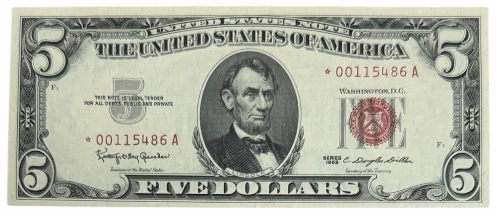 1963 United States $5.00 Red Seal Silver Certificate Star Note: 1963 United States $5.00 Red Seal Silver Certificate Star Note. The notes is in uncirculated condition. Serial number *00115486 A.