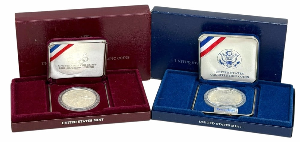 U.S. Mint 1987 Constitution & 1988 Olympic Commemorative Proof & Uncirculated Silver Dollars: U.S. Mint 1987 Constitution Uncirculated & 1988 Olympic Proof Commemorative Silver Dollars. The coins are in new condition in the original boxes, The 1987 has a COA, the 1988 does not. Each dollar is