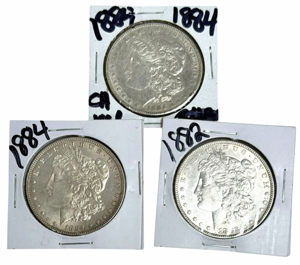 1882 & (2) 1884 United States Morgan Silver Dollars: 1882 & (2) 1884 United States Morgan Silver Dollars. Better condition coins.