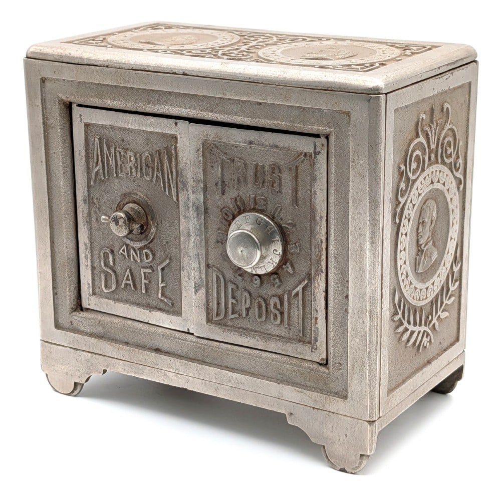 American Trust and Safe Deposit Cast iron Still Bank: Hard to find cast iron Kyser & Rex American Trust and Safe Deposit still bank. The bank is very ornate and shows medallions of George Washington, Abraham Lincoln, Ulysses S. Grant and other Civil War
