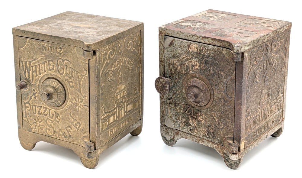 (2) Nicol & Co. No. 12 White City Puzzle Safe Banks: (2) Nicol & Co. No. 12 White City Puzzle Safe still banks. The one bank has a repair to one of the feet. Both have paint loss, discoloration and wear from use and age. Unknown combinations. Each measu