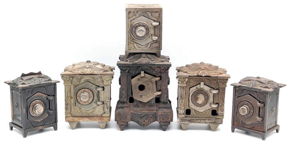 (6) Klotz Mfg. Co. & Other Cast Iron Safe Still Banks: Includes three Klotz Mfg. Co. and three unmarked cast iron safe still banks. The two Klotz banks are missing the barred doors and the one is missing the dial. All show wear from use and age. No combin