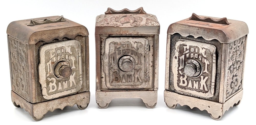 (3) Cast Iron Coin Deposit Banks: (3) Cast iron coin deposit banks. The one bank has a small factory crack on the door. The one bank is opened and the other two are locked. No combinations for any of the banks. The banks show wear fro