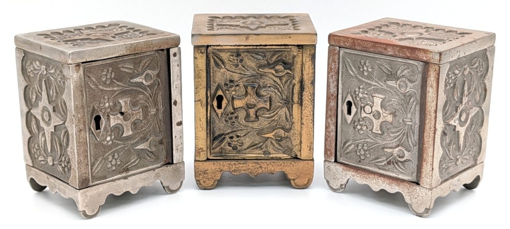 (3) J&E Stevens Cast Iron Key Lock Safe No. 50 Safe Banks: (3) J&E Stevens cast iron Key Lock Safe No. 50 still safe banks. No keys included. the banks have plating loss and wear from use and age. Each measures approximately 4-1/4" tall.