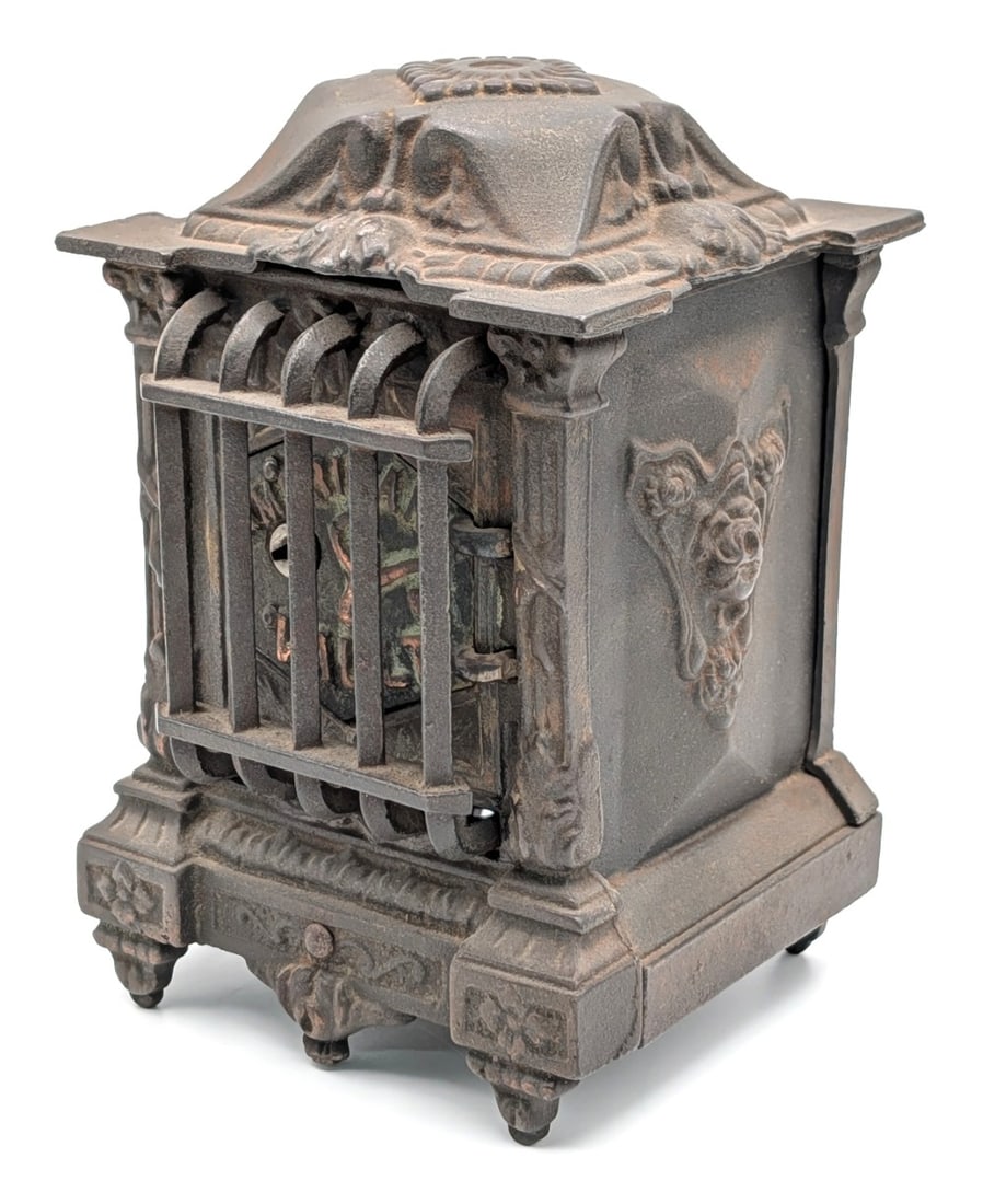 Klotz Mfg. Co. American Vault Cast Iron Still Bank: Klotz Mfg. Co. American Vault cast iron still bank with barred door. The bank comes with the key. It does show a tiny crack in the base and wear from use and age. Measures approximately 7-1/2" tall.?