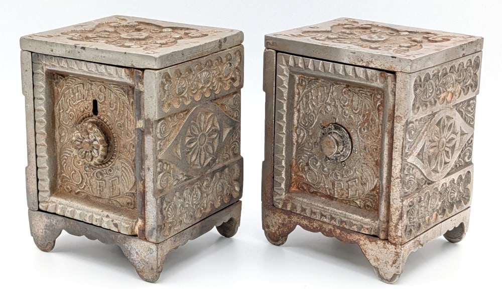 (2) J&E Stevens Key Combination Safe Cast Iron Still Banks: (2) J&E Stevens Treasure Safe cast iron still banks. The banks are locked with no combinations included. Both have plating loss, surface rust, and wear from use and age. Each measures approximately 5"