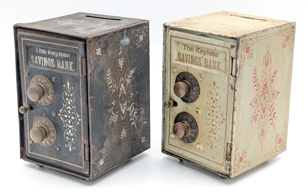 (2) Keyless Lock Co. "The Keyless Savings Bank": (2) Vintage tin "The Keyless Savings Bank" by The Keyless Lock Co. out of Indianapolis Indiana. Both show some paint loss, discoloration, and wear from use and age. Both display well with stenciling a