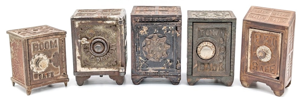 Cast Iron Town Bank, Boom Safe, Pet Safe, Ideal Safe Deposit, and Security Deposit Safe Still Banks (1 of 14)