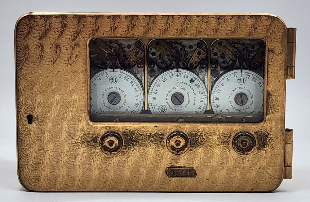 Yale & Towne Mfg Co Bank Vault Time Lock: Yale & Towne is a company in Stamford Connecticut. Lock uses 3 watch mechanisms to lock the safe at certain times. Metal is worn due to age and handling. Does not include a key. Measures approximately
