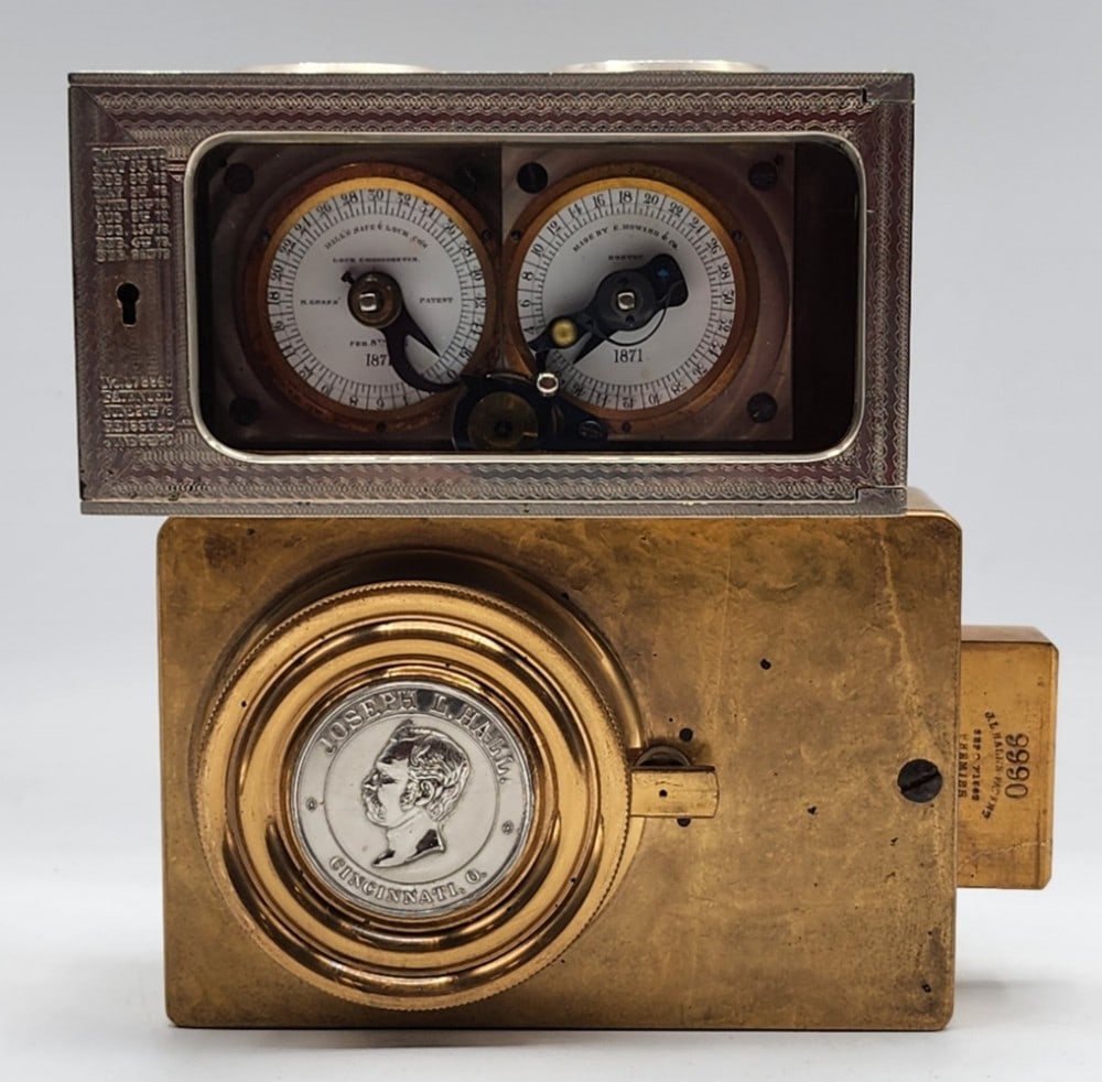 Hall's Safe & Lock Co's Bank Vault Time Lock Mechanism: Made by E. Howard & Co in Boston Massachusetts. Patented July 5th, 1870.? Marked 9990. Lock uses 2 independent watch mechanisms to lock the safe at certain times. Light wear due to age and use. Does n